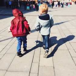 Woman standing on footpath