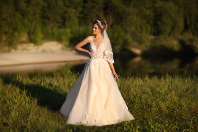 Bride against the background of the river
