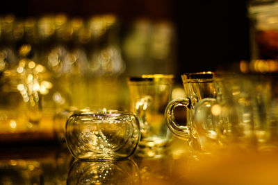 Close-up of wine glasses on table