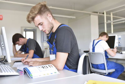 Vocational school students writing a test