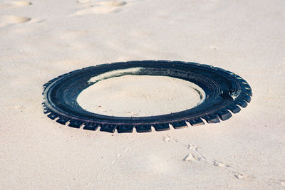 High angle view of camera on sand