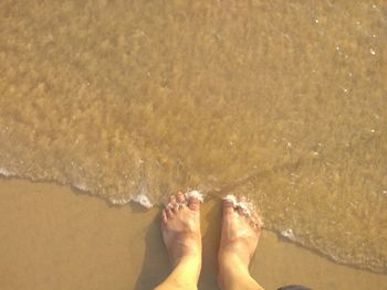 Low section of legs on beach