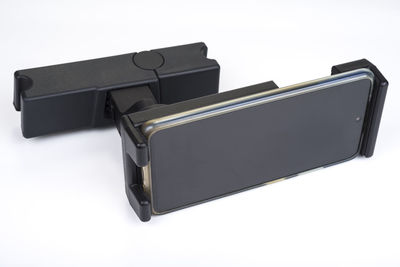 Close-up of camera against white background