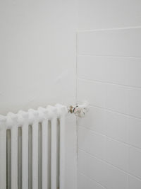 Close-up of white pipes on wall at home