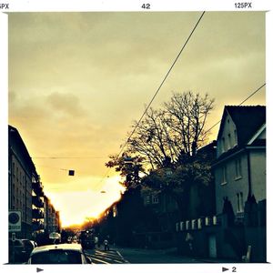 View of buildings in city at sunset