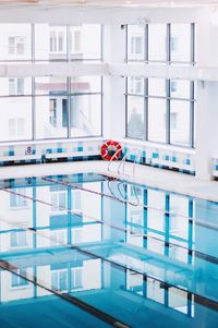 Reflection of building on swimming pool