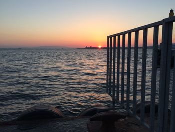 Scenic view of sea against clear sky during sunset