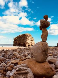 Rocks balancing on a beack