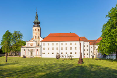 View of buildings against blue sky