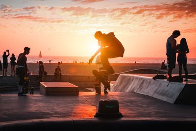 Sunset photograph of skateboarder at venice beach los angeles