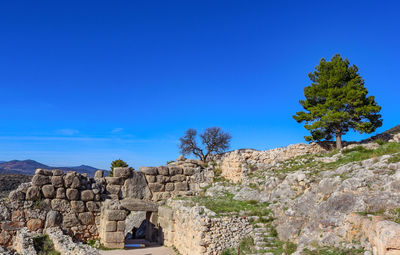 Ruins of building against blue sky