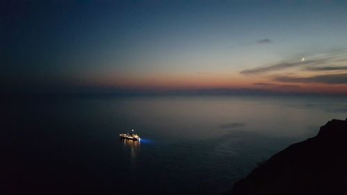 Scenic view of sea against sky at sunset