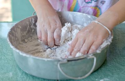 Close-up of man preparing food in bowl