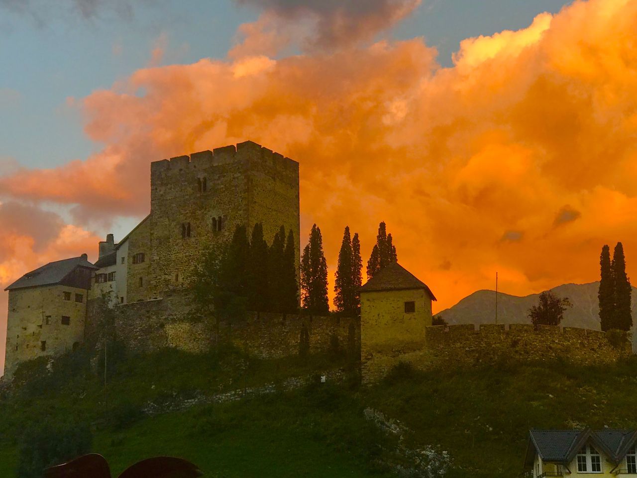 HISTORIC BUILDING AGAINST CLOUDY SKY DURING SUNSET