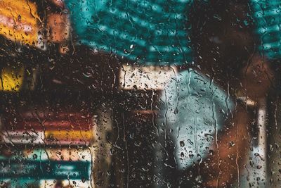 Raindrops on glass window during rainy season