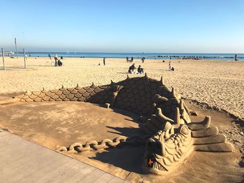 Sculpture on sand at beach