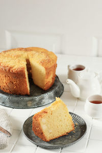 Soft and fluffy cheese chiffon cake on white table