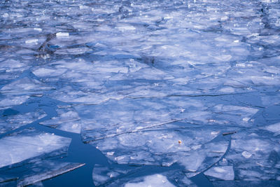 Full frame shot of ice floating on water