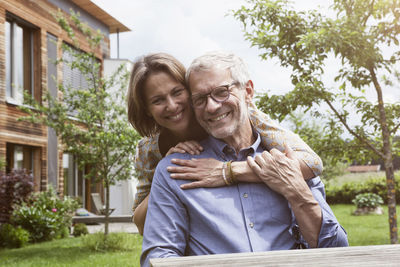 Portrait of happy mature couple in garden