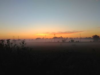 Scenic view of silhouette landscape against sky during sunset