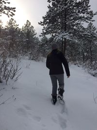 People standing on snow covered landscape