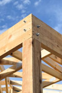 Low angle view of wooden structure against sky