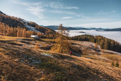Panoramic view of land and mountains against sky