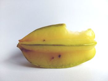 Close-up of lemon against white background