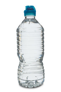 Close-up of glass bottle on white background