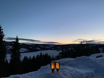 Snow covered mountain against sky during sunset