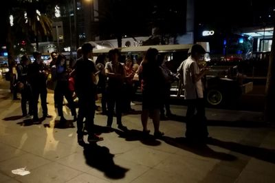 People on street at night