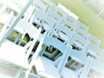 High angle view of chairs in grass