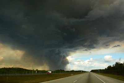 Road against cloudy sky