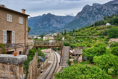 High angle view of buildings and mountains against sky