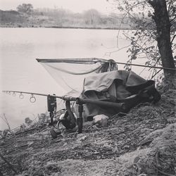 Tractor on shore against sky