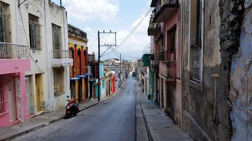 Road amidst buildings in city