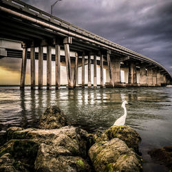 View of bridge against cloudy sky