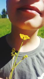 Close-up of woman with flower head