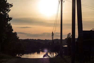 Scenic view of lake against orange sky