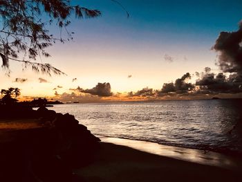 Scenic view of sea against sky at sunset