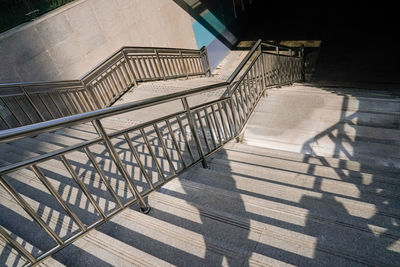 High angle view of staircase in building during sunny day
