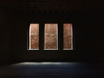 Brick wall seen through windows