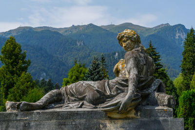 Statue of a woman at the peles castle in romania