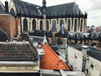 Buildings in city against sky