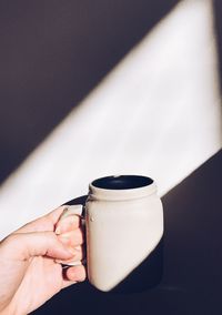 Close-up of hand holding drink