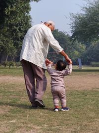 A grandparent with his grandchild