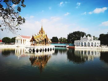 View of temple building against cloudy sky