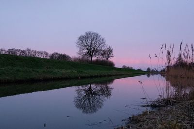 Scenic view of lake against sky during sunset