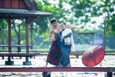 Rear view of couple kissing outdoors