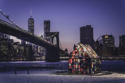 Illuminated city against clear sky